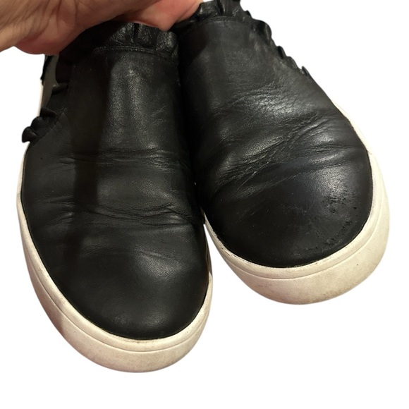 kate spade | Shoes | Kate Spade Lilly Ruffle Trim Leather  KATE SPADE LILLY RUFFLE TRIM LEATHER BLACK WHITE SLIPON RUFFLE SNEAKER SHOE 9